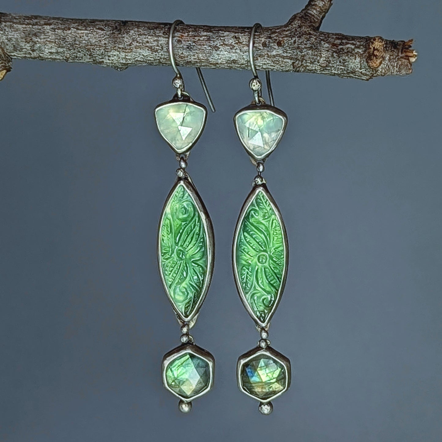 Carved serpentine, labradorite, and prehnite artisan statement earrings.